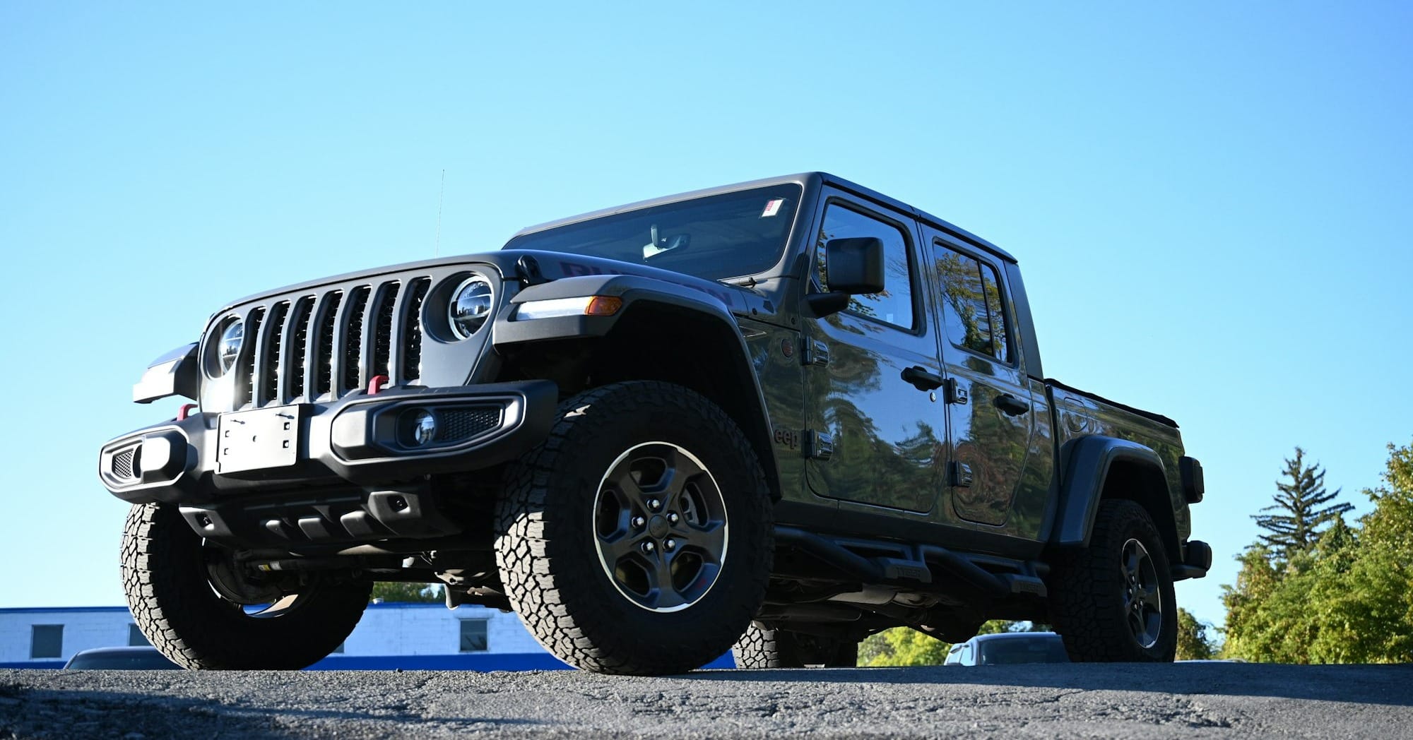 a black jeep parked on the side of a road